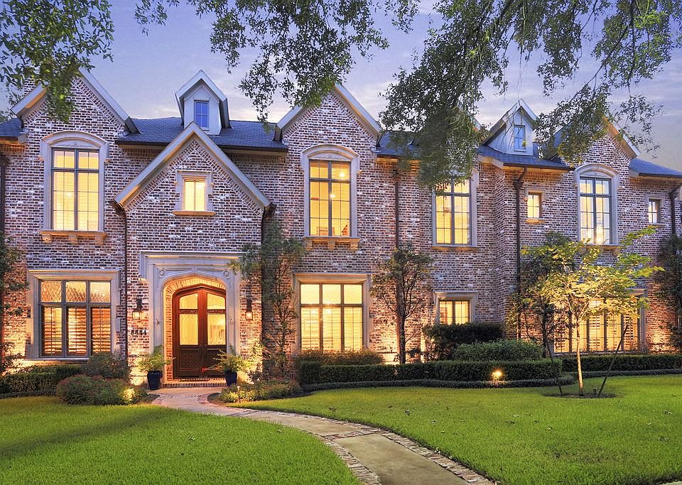 elegant brick house with an attic